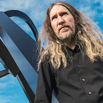 Anthony Metivier with a Brisbane statue for causes of forgetting feature image