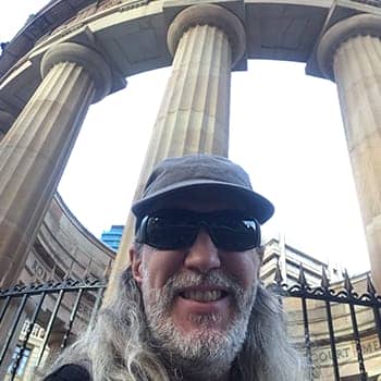 Modern day polymath feature image of Anthony Metivier with pillars in Brisbane